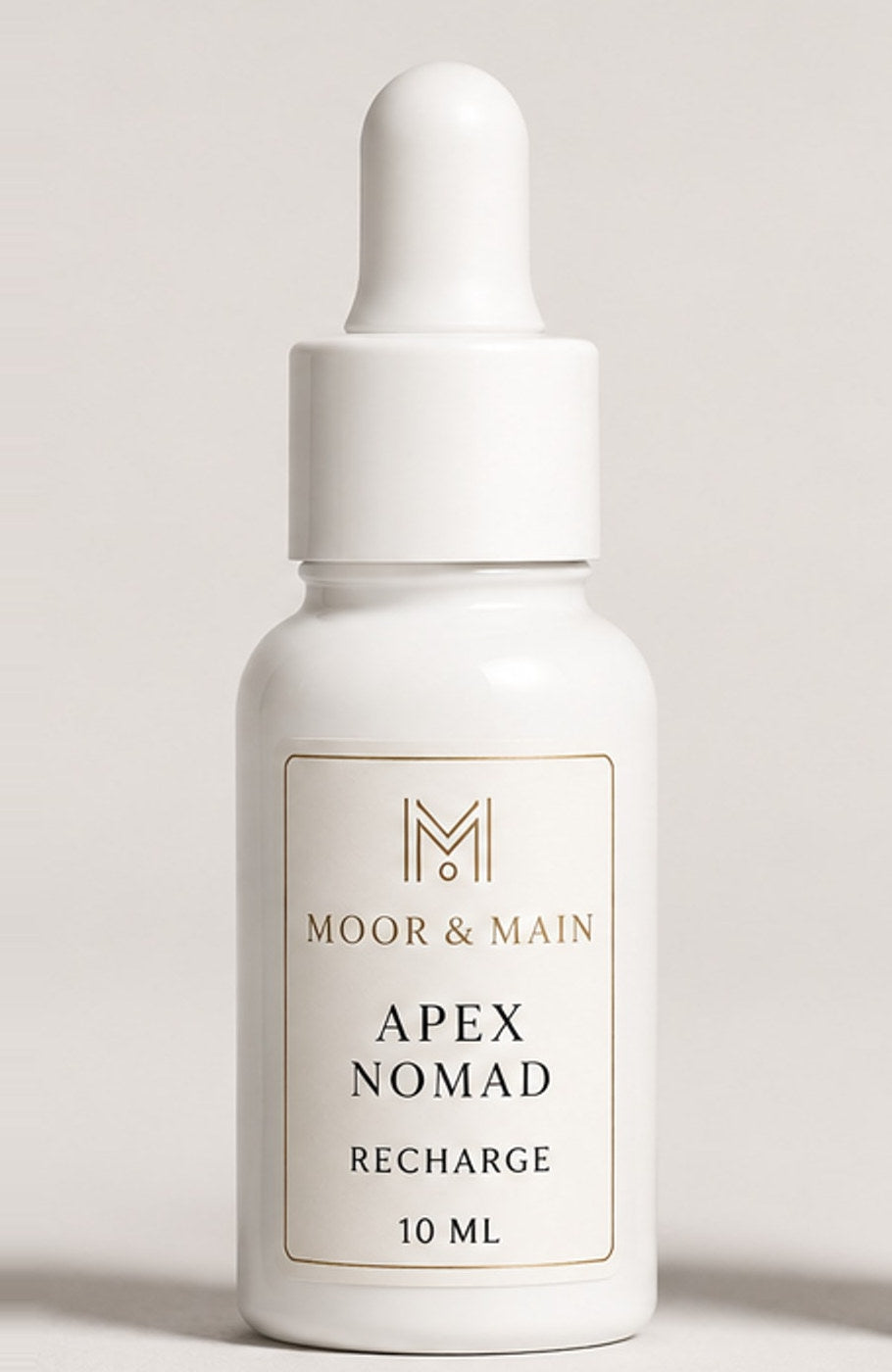 Recharge Apex Nomad 10 ml, flacon blanc et étiquette ivoire et or
